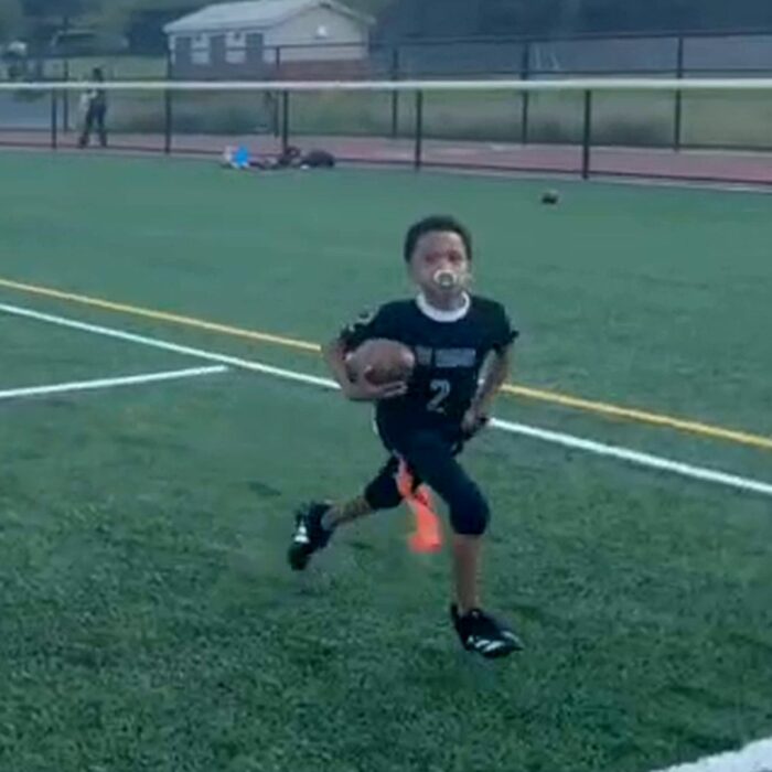 Yahdeil Hotdog G. running with the football for the East Orange Rams